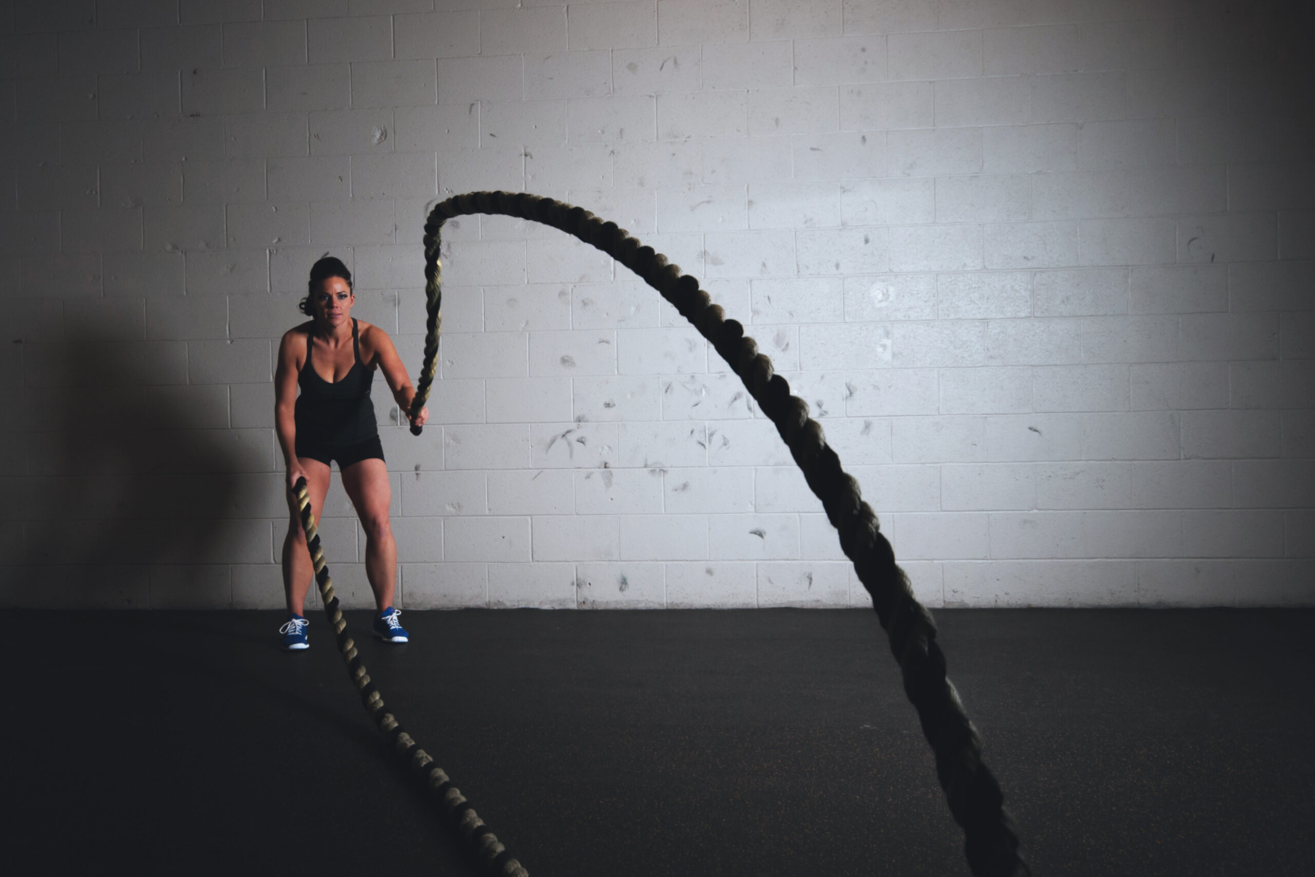 Woman holding exercise ropes